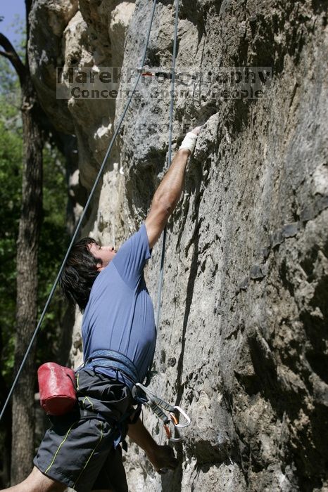 Javier Morales on the dyno while leading Lick the Window (5.10c).  It was another long day of rock climbing at Seismic Wall on Austin's Barton Creek Greenbelt, Sunday, April 5, 2009.

Filename: SRM_20090405_11483880.jpg
Aperture: f/5.6
Shutter Speed: 1/500
Body: Canon EOS-1D Mark II
Lens: Canon EF 80-200mm f/2.8 L