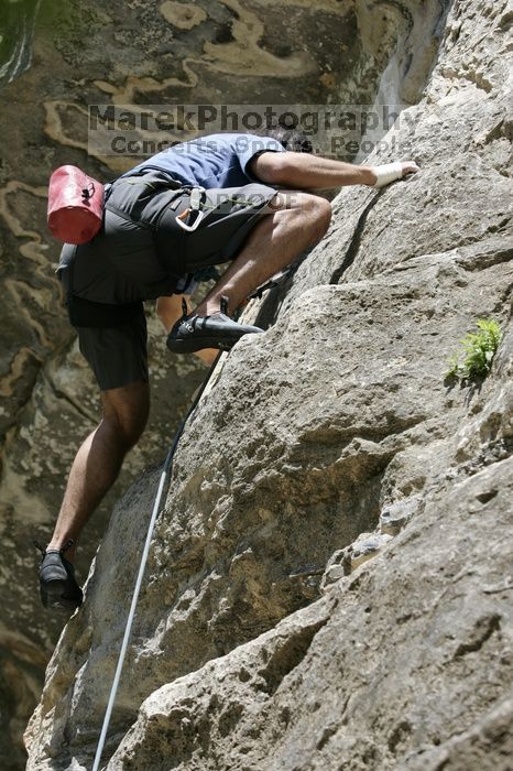 Javier Morales on the dyno while leading Lick the Window (5.10c).  It was another long day of rock climbing at Seismic Wall on Austin's Barton Creek Greenbelt, Sunday, April 5, 2009.

Filename: SRM_20090405_11513489.jpg
Aperture: f/5.6
Shutter Speed: 1/500
Body: Canon EOS-1D Mark II
Lens: Canon EF 80-200mm f/2.8 L