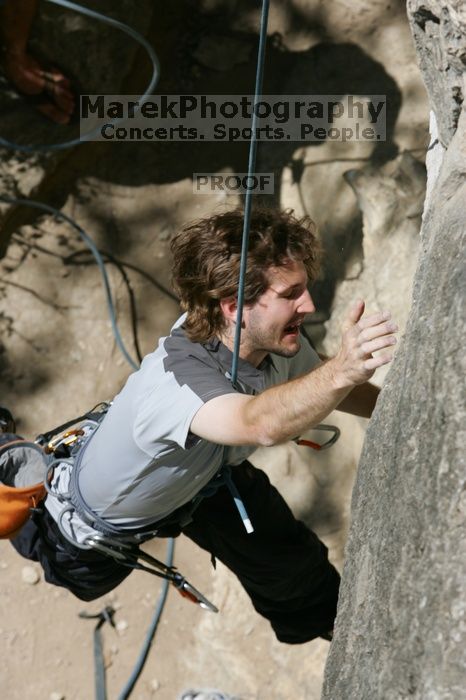 Andrew Dreher attempting the dyno while leading Lick the Window (5.10c), shot from the top of Ack! (5.11b, but using the crack for the start instead) that I top roped up with my camera on my back.  It was another long day of rock climbing at Seismic Wall on Austin's Barton Creek Greenbelt, Sunday, April 5, 2009.

Filename: SRM_20090405_13163018.jpg
Aperture: f/9.0
Shutter Speed: 1/500
Body: Canon EOS-1D Mark II
Lens: Canon EF 80-200mm f/2.8 L