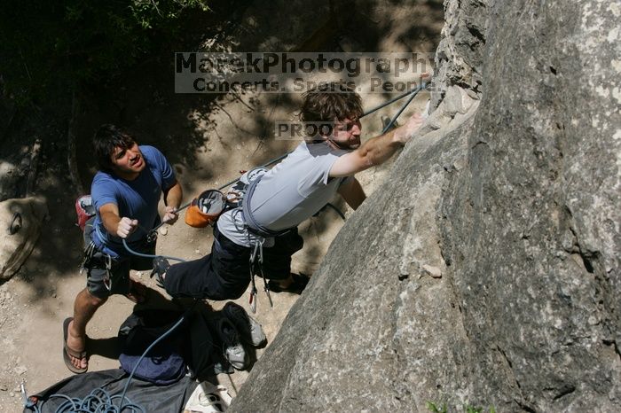 Andrew Dreher attempting the dyno while leading Lick the Window (5.10c) with Javier Morales belaying, shot from the top of Ack! (5.11b, but using the crack for the start instead) that I top roped up with my camera on my back.  It was another long day of rock climbing at Seismic Wall on Austin's Barton Creek Greenbelt, Sunday, April 5, 2009.

Filename: SRM_20090405_13212142.jpg
Aperture: f/11.0
Shutter Speed: 1/500
Body: Canon EOS-1D Mark II
Lens: Canon EF 80-200mm f/2.8 L