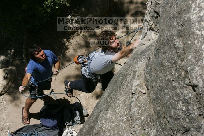 Andrew Dreher attempting the dyno while leading Lick the Window (5.10c) with Javier Morales belaying, shot from the top of Ack! (5.11b, but using the crack for the start instead) that I top roped up with my camera on my back.  It was another long day of rock climbing at Seismic Wall on Austin's Barton Creek Greenbelt, Sunday, April 5, 2009.

Filename: SRM_20090405_13212144.jpg
Aperture: f/11.0
Shutter Speed: 1/500
Body: Canon EOS-1D Mark II
Lens: Canon EF 80-200mm f/2.8 L