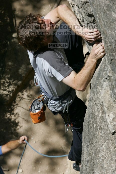 Andrew Dreher leading Lick the Window (5.10c), shot from the top of Ack! (5.11b, but using the crack for the start instead) that I top roped up with my camera on my back.  It was another long day of rock climbing at Seismic Wall on Austin's Barton Creek Greenbelt, Sunday, April 5, 2009.

Filename: SRM_20090405_13214956.jpg
Aperture: f/10.0
Shutter Speed: 1/500
Body: Canon EOS-1D Mark II
Lens: Canon EF 80-200mm f/2.8 L