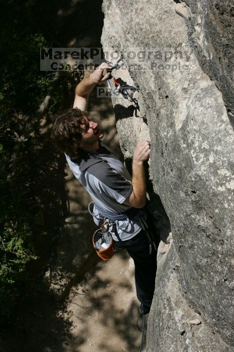 Andrew Dreher leading Lick the Window (5.10c), shot from the top of Ack! (5.11b, but using the crack for the start instead) that I top roped up with my camera on my back.  It was another long day of rock climbing at Seismic Wall on Austin's Barton Creek Greenbelt, Sunday, April 5, 2009.

Filename: SRM_20090405_13215966.jpg
Aperture: f/11.0
Shutter Speed: 1/500
Body: Canon EOS-1D Mark II
Lens: Canon EF 80-200mm f/2.8 L