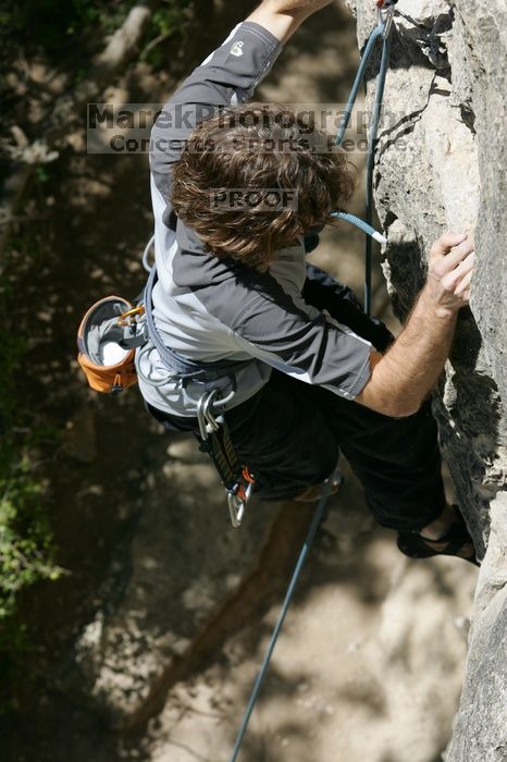 Andrew Dreher leading Lick the Window (5.10c), shot from the top of Ack! (5.11b, but using the crack for the start instead) that I top roped up with my camera on my back.  It was another long day of rock climbing at Seismic Wall on Austin's Barton Creek Greenbelt, Sunday, April 5, 2009.

Filename: SRM_20090405_13223376.jpg
Aperture: f/8.0
Shutter Speed: 1/500
Body: Canon EOS-1D Mark II
Lens: Canon EF 80-200mm f/2.8 L