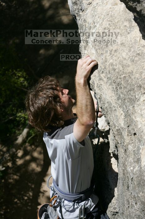 Andrew Dreher leading Lick the Window (5.10c), shot from the top of Ack! (5.11b, but using the crack for the start instead) that I top roped up with my camera on my back.  It was another long day of rock climbing at Seismic Wall on Austin's Barton Creek Greenbelt, Sunday, April 5, 2009.

Filename: SRM_20090405_13224282.jpg
Aperture: f/9.0
Shutter Speed: 1/500
Body: Canon EOS-1D Mark II
Lens: Canon EF 80-200mm f/2.8 L