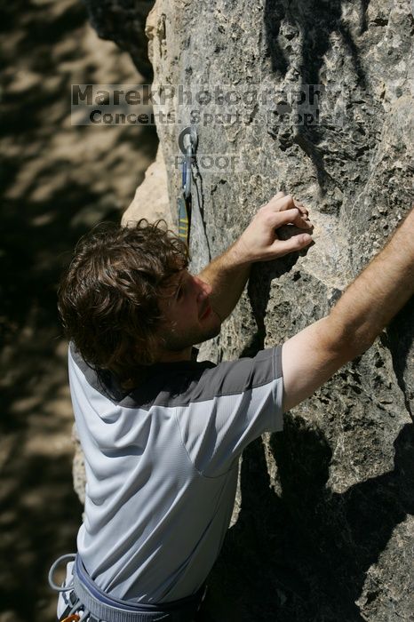 Andrew Dreher leading Lick the Window (5.10c), shot from the top of Ack! (5.11b, but using the crack for the start instead) that I top roped up with my camera on my back.  It was another long day of rock climbing at Seismic Wall on Austin's Barton Creek Greenbelt, Sunday, April 5, 2009.

Filename: SRM_20090405_13234128.jpg
Aperture: f/7.1
Shutter Speed: 1/500
Body: Canon EOS-1D Mark II
Lens: Canon EF 80-200mm f/2.8 L