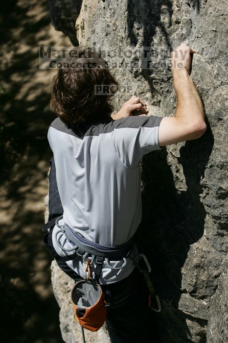 Andrew Dreher leading Lick the Window (5.10c), shot from the top of Ack! (5.11b, but using the crack for the start instead) that I top roped up with my camera on my back.  It was another long day of rock climbing at Seismic Wall on Austin's Barton Creek Greenbelt, Sunday, April 5, 2009.

Filename: SRM_20090405_13234329.jpg
Aperture: f/7.1
Shutter Speed: 1/500
Body: Canon EOS-1D Mark II
Lens: Canon EF 80-200mm f/2.8 L