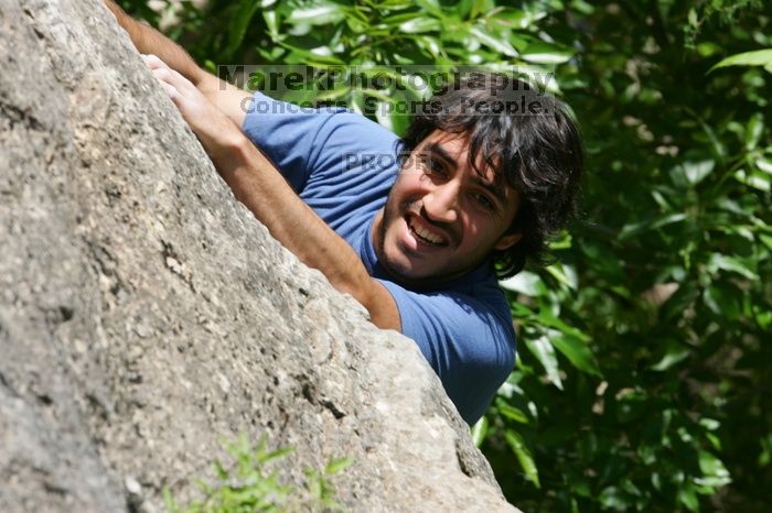 Javier Morales leading Nose Print on the Windshield (5.11c), shot from the top of Ack! (5.11b, but using the crack for the start instead) that I top roped up with my camera on my back.  It was another long day of rock climbing at Seismic Wall on Austin's Barton Creek Greenbelt, Sunday, April 5, 2009.

Filename: SRM_20090405_13321260.jpg
Aperture: f/9.0
Shutter Speed: 1/500
Body: Canon EOS-1D Mark II
Lens: Canon EF 80-200mm f/2.8 L