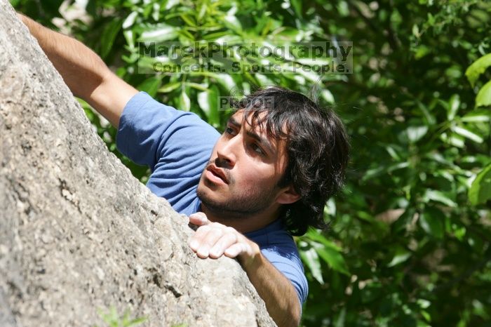 Javier Morales leading Nose Print on the Windshield (5.11c), shot from the top of Ack! (5.11b, but using the crack for the start instead) that I top roped up with my camera on my back.  It was another long day of rock climbing at Seismic Wall on Austin's Barton Creek Greenbelt, Sunday, April 5, 2009.

Filename: SRM_20090405_13321363.jpg
Aperture: f/8.0
Shutter Speed: 1/500
Body: Canon EOS-1D Mark II
Lens: Canon EF 80-200mm f/2.8 L