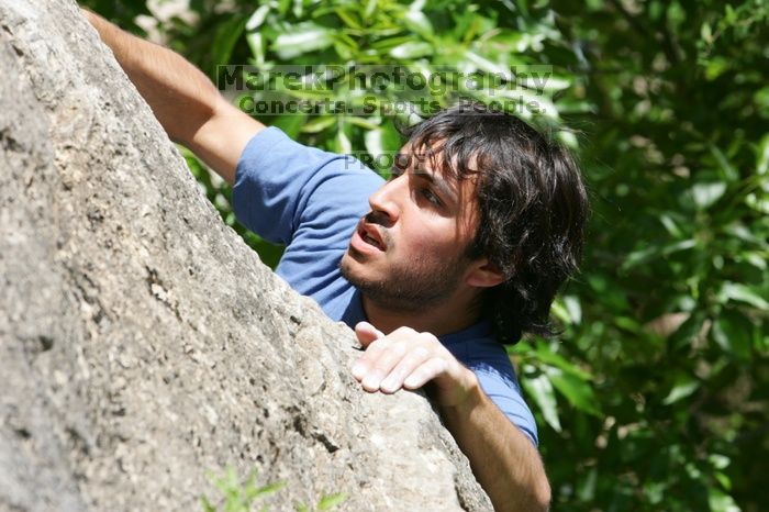 Javier Morales leading Nose Print on the Windshield (5.11c), shot from the top of Ack! (5.11b, but using the crack for the start instead) that I top roped up with my camera on my back.  It was another long day of rock climbing at Seismic Wall on Austin's Barton Creek Greenbelt, Sunday, April 5, 2009.

Filename: SRM_20090405_13321364.jpg
Aperture: f/8.0
Shutter Speed: 1/500
Body: Canon EOS-1D Mark II
Lens: Canon EF 80-200mm f/2.8 L