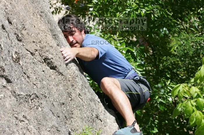 Javier Morales leading Nose Print on the Windshield (5.11c), shot from the top of Ack! (5.11b, but using the crack for the start instead) that I top roped up with my camera on my back.  It was another long day of rock climbing at Seismic Wall on Austin's Barton Creek Greenbelt, Sunday, April 5, 2009.

Filename: SRM_20090405_13340184.jpg
Aperture: f/9.0
Shutter Speed: 1/500
Body: Canon EOS-1D Mark II
Lens: Canon EF 80-200mm f/2.8 L