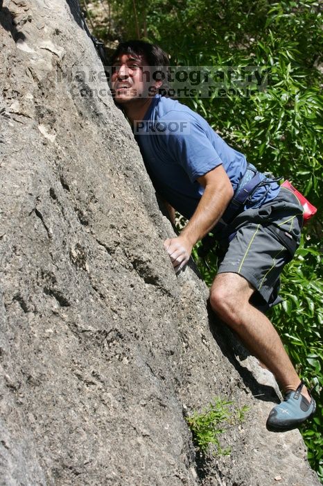 Javier Morales leading Nose Print on the Windshield (5.11c), shot from the top of Ack! (5.11b, but using the crack for the start instead) that I top roped up with my camera on my back.  It was another long day of rock climbing at Seismic Wall on Austin's Barton Creek Greenbelt, Sunday, April 5, 2009.

Filename: SRM_20090405_13340889.jpg
Aperture: f/10.0
Shutter Speed: 1/500
Body: Canon EOS-1D Mark II
Lens: Canon EF 80-200mm f/2.8 L