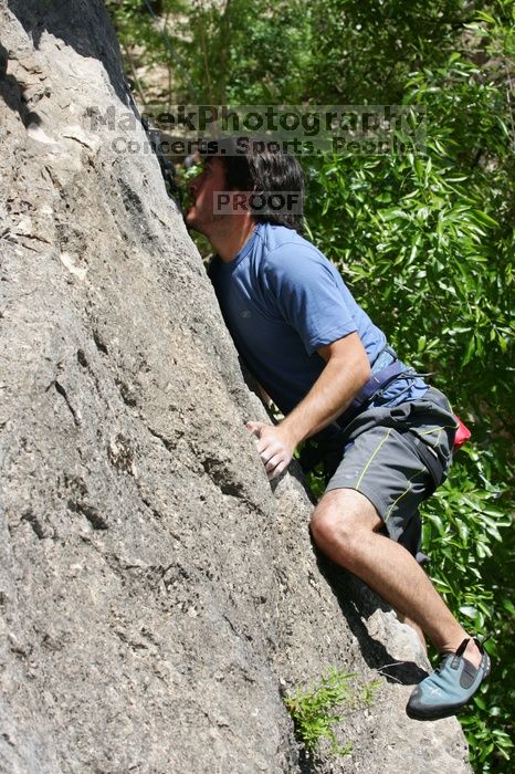 Javier Morales leading Nose Print on the Windshield (5.11c), shot from the top of Ack! (5.11b, but using the crack for the start instead) that I top roped up with my camera on my back.  It was another long day of rock climbing at Seismic Wall on Austin's Barton Creek Greenbelt, Sunday, April 5, 2009.

Filename: SRM_20090405_13341091.jpg
Aperture: f/9.0
Shutter Speed: 1/500
Body: Canon EOS-1D Mark II
Lens: Canon EF 80-200mm f/2.8 L