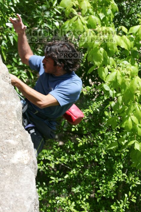 Javier Morales leading Nose Print on the Windshield (5.11c), shot from the top of Ack! (5.11b, but using the crack for the start instead) that I top roped up with my camera on my back.  It was another long day of rock climbing at Seismic Wall on Austin's Barton Creek Greenbelt, Sunday, April 5, 2009.

Filename: SRM_20090405_13342902.jpg
Aperture: f/7.1
Shutter Speed: 1/500
Body: Canon EOS-1D Mark II
Lens: Canon EF 80-200mm f/2.8 L