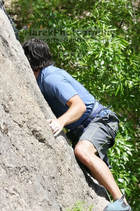 Javier Morales leading Nose Print on the Windshield (5.11c), shot from the top of Ack! (5.11b, but using the crack for the start instead) that I top roped up with my camera on my back.  It was another long day of rock climbing at Seismic Wall on Austin's Barton Creek Greenbelt, Sunday, April 5, 2009.

Filename: SRM_20090405_13371310.jpg
Aperture: f/7.1
Shutter Speed: 1/500
Body: Canon EOS-1D Mark II
Lens: Canon EF 80-200mm f/2.8 L