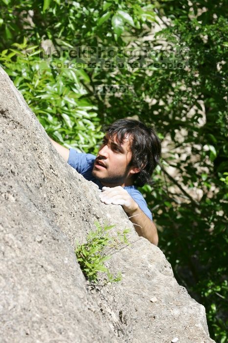 Javier Morales leading Nose Print on the Windshield (5.11c), shot from the top of Ack! (5.11b, but using the crack for the start instead) that I top roped up with my camera on my back.  It was another long day of rock climbing at Seismic Wall on Austin's Barton Creek Greenbelt, Sunday, April 5, 2009.

Filename: SRM_20090405_14560582.jpg
Aperture: f/8.0
Shutter Speed: 1/500
Body: Canon EOS-1D Mark II
Lens: Canon EF 80-200mm f/2.8 L