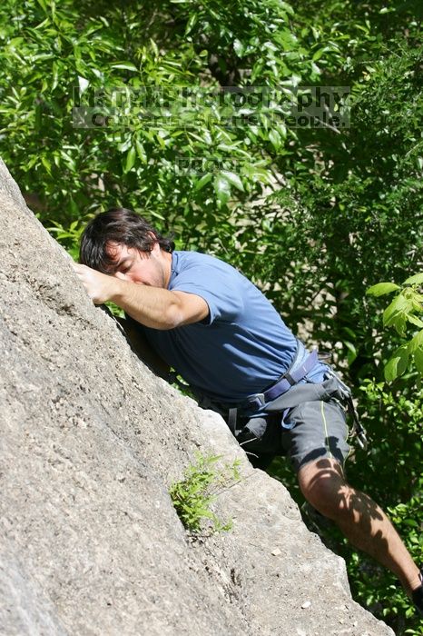 Javier Morales leading Nose Print on the Windshield (5.11c), shot from the top of Ack! (5.11b, but using the crack for the start instead) that I top roped up with my camera on my back.  It was another long day of rock climbing at Seismic Wall on Austin's Barton Creek Greenbelt, Sunday, April 5, 2009.

Filename: SRM_20090405_14561584.jpg
Aperture: f/9.0
Shutter Speed: 1/500
Body: Canon EOS-1D Mark II
Lens: Canon EF 80-200mm f/2.8 L