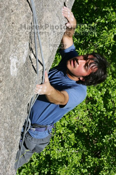 Javier Morales top rope climbing She's No Dog, She's My Wife (5.11b), shot from the top of Ack! (5.11b, but using the crack for the start instead) that I top roped up with my camera on my back.  It was another long day of rock climbing at Seismic Wall on Austin's Barton Creek Greenbelt, Sunday, April 5, 2009.

Filename: SRM_20090405_16172906.jpg
Aperture: f/11.0
Shutter Speed: 1/500
Body: Canon EOS-1D Mark II
Lens: Canon EF 80-200mm f/2.8 L