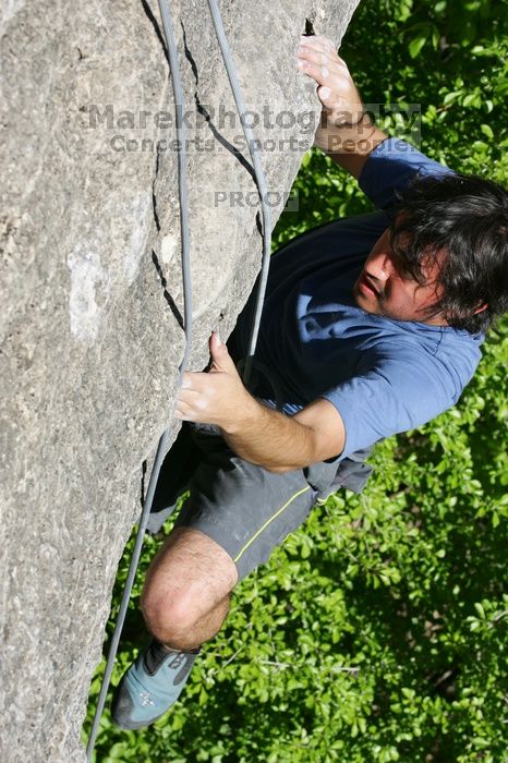 Javier Morales top rope climbing She's No Dog, She's My Wife (5.11b), shot from the top of Ack! (5.11b, but using the crack for the start instead) that I top roped up with my camera on my back.  It was another long day of rock climbing at Seismic Wall on Austin's Barton Creek Greenbelt, Sunday, April 5, 2009.

Filename: SRM_20090405_16173309.jpg
Aperture: f/10.0
Shutter Speed: 1/500
Body: Canon EOS-1D Mark II
Lens: Canon EF 80-200mm f/2.8 L