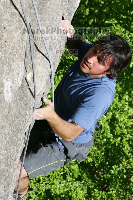 Javier Morales top rope climbing She's No Dog, She's My Wife (5.11b), shot from the top of Ack! (5.11b, but using the crack for the start instead) that I top roped up with my camera on my back.  It was another long day of rock climbing at Seismic Wall on Austin's Barton Creek Greenbelt, Sunday, April 5, 2009.

Filename: SRM_20090405_16173410.jpg
Aperture: f/10.0
Shutter Speed: 1/500
Body: Canon EOS-1D Mark II
Lens: Canon EF 80-200mm f/2.8 L