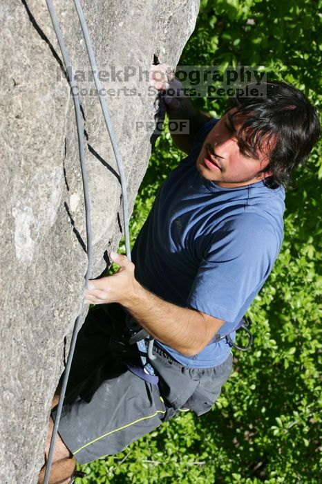 Javier Morales top rope climbing She's No Dog, She's My Wife (5.11b), shot from the top of Ack! (5.11b, but using the crack for the start instead) that I top roped up with my camera on my back.  It was another long day of rock climbing at Seismic Wall on Austin's Barton Creek Greenbelt, Sunday, April 5, 2009.

Filename: SRM_20090405_16173411.jpg
Aperture: f/10.0
Shutter Speed: 1/500
Body: Canon EOS-1D Mark II
Lens: Canon EF 80-200mm f/2.8 L