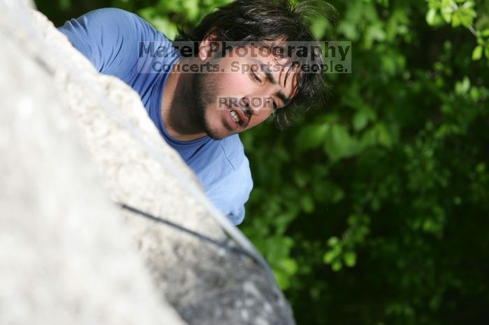 Javier Morales top rope climbing She's No Dog, She's My Wife (5.11b), shot from the top of Ack! (5.11b, but using the crack for the start instead) that I top roped up with my camera on my back.  It was another long day of rock climbing at Seismic Wall on Austin's Barton Creek Greenbelt, Sunday, April 5, 2009.

Filename: SRM_20090405_16472635.jpg
Aperture: f/4.5
Shutter Speed: 1/500
Body: Canon EOS-1D Mark II
Lens: Canon EF 80-200mm f/2.8 L