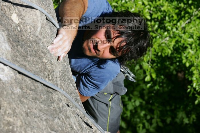 Javier Morales top rope climbing She's No Dog, She's My Wife (5.11b), shot from the top of Ack! (5.11b, but using the crack for the start instead) that I top roped up with my camera on my back.  It was another long day of rock climbing at Seismic Wall on Austin's Barton Creek Greenbelt, Sunday, April 5, 2009.

Filename: SRM_20090405_16481447.jpg
Aperture: f/9.0
Shutter Speed: 1/500
Body: Canon EOS-1D Mark II
Lens: Canon EF 80-200mm f/2.8 L