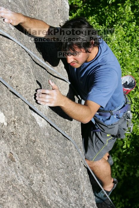 Javier Morales top rope climbing She's No Dog, She's My Wife (5.11b), shot from the top of Ack! (5.11b, but using the crack for the start instead) that I top roped up with my camera on my back.  It was another long day of rock climbing at Seismic Wall on Austin's Barton Creek Greenbelt, Sunday, April 5, 2009.

Filename: SRM_20090405_16482754.jpg
Aperture: f/8.0
Shutter Speed: 1/500
Body: Canon EOS-1D Mark II
Lens: Canon EF 80-200mm f/2.8 L