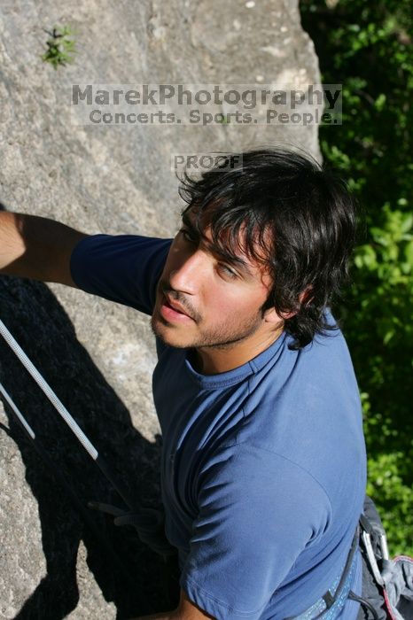 Javier Morales top rope climbing She's No Dog, She's My Wife (5.11b), shot from the top of Ack! (5.11b, but using the crack for the start instead) that I top roped up with my camera on my back.  It was another long day of rock climbing at Seismic Wall on Austin's Barton Creek Greenbelt, Sunday, April 5, 2009.

Filename: SRM_20090405_16484665.jpg
Aperture: f/9.0
Shutter Speed: 1/500
Body: Canon EOS-1D Mark II
Lens: Canon EF 80-200mm f/2.8 L