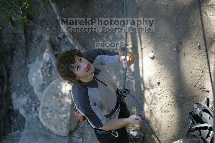 Andrew Dreher getting ready to belay me on top rope up Lick the Window (5.10c), shot by Javier Morales from the top of Ack! (5.11b, but using the crack for the start instead) that I top roped up with my camera on my back.  It was another long day of rock climbing at Seismic Wall on Austin's Barton Creek Greenbelt, Sunday, April 5, 2009.

Filename: SRM_20090405_17142979.jpg
Aperture: f/2.8
Shutter Speed: 1/400
Body: Canon EOS-1D Mark II
Lens: Canon EF 80-200mm f/2.8 L