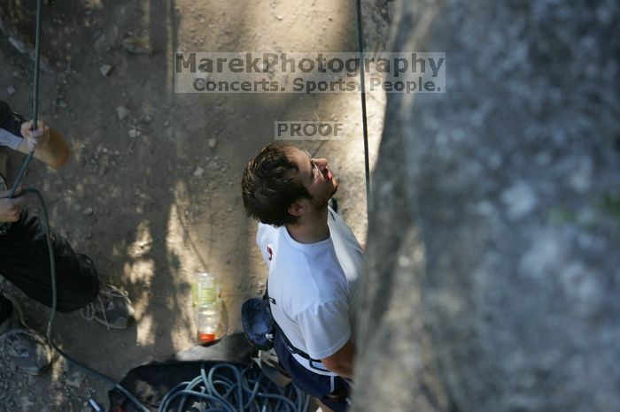 Me top roping Lick the Window (5.10c), shot by Javier Morales from the top of Ack! (5.11b, but using the crack for the start instead) that I top roped up with my camera on my back.  It was another long day of rock climbing at Seismic Wall on Austin's Barton Creek Greenbelt, Sunday, April 5, 2009.

Filename: SRM_20090405_17173690.jpg
Aperture: f/3.2
Shutter Speed: 1/400
Body: Canon EOS-1D Mark II
Lens: Canon EF 80-200mm f/2.8 L