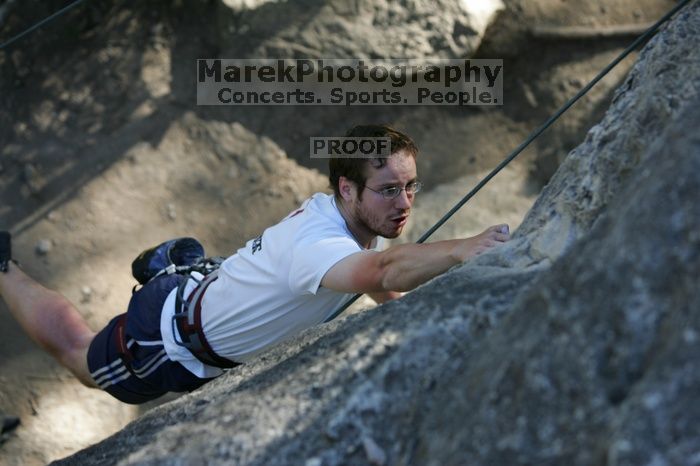 Me top roping Lick the Window (5.10c), shot by Javier Morales from the top of Ack! (5.11b, but using the crack for the start instead) that I top roped up with my camera on my back.  It was another long day of rock climbing at Seismic Wall on Austin's Barton Creek Greenbelt, Sunday, April 5, 2009.

Filename: SRM_20090405_17181604.jpg
Aperture: f/3.5
Shutter Speed: 1/400
Body: Canon EOS-1D Mark II
Lens: Canon EF 80-200mm f/2.8 L