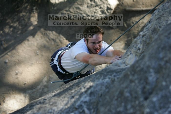 Me top roping Lick the Window (5.10c), shot by Javier Morales from the top of Ack! (5.11b, but using the crack for the start instead) that I top roped up with my camera on my back.  It was another long day of rock climbing at Seismic Wall on Austin's Barton Creek Greenbelt, Sunday, April 5, 2009.

Filename: SRM_20090405_17181608.jpg
Aperture: f/3.5
Shutter Speed: 1/400
Body: Canon EOS-1D Mark II
Lens: Canon EF 80-200mm f/2.8 L