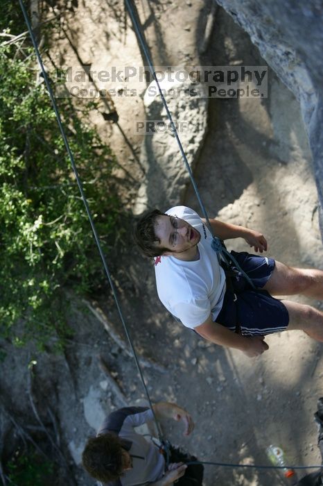 Me top roping Lick the Window (5.10c), shot by Javier Morales from the top of Ack! (5.11b, but using the crack for the start instead) that I top roped up with my camera on my back.  It was another long day of rock climbing at Seismic Wall on Austin's Barton Creek Greenbelt, Sunday, April 5, 2009.

Filename: SRM_20090405_17190664.jpg
Aperture: f/3.2
Shutter Speed: 1/400
Body: Canon EOS-1D Mark II
Lens: Canon EF 80-200mm f/2.8 L