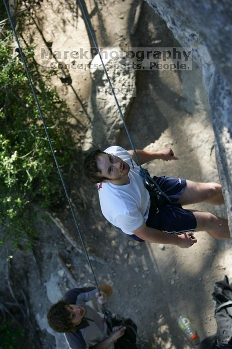 Me top roping Lick the Window (5.10c), shot by Javier Morales from the top of Ack! (5.11b, but using the crack for the start instead) that I top roped up with my camera on my back.  It was another long day of rock climbing at Seismic Wall on Austin's Barton Creek Greenbelt, Sunday, April 5, 2009.

Filename: SRM_20090405_17190666.jpg
Aperture: f/3.2
Shutter Speed: 1/400
Body: Canon EOS-1D Mark II
Lens: Canon EF 80-200mm f/2.8 L