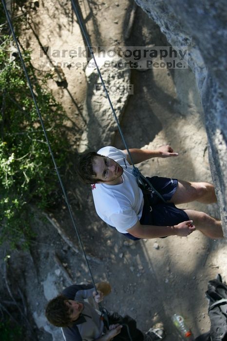 Me top roping Lick the Window (5.10c), shot by Javier Morales from the top of Ack! (5.11b, but using the crack for the start instead) that I top roped up with my camera on my back.  It was another long day of rock climbing at Seismic Wall on Austin's Barton Creek Greenbelt, Sunday, April 5, 2009.

Filename: SRM_20090405_17190667.jpg
Aperture: f/3.5
Shutter Speed: 1/400
Body: Canon EOS-1D Mark II
Lens: Canon EF 80-200mm f/2.8 L