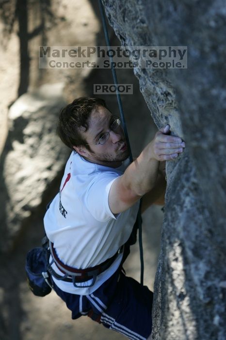 Me top roping Lick the Window (5.10c), shot by Javier Morales from the top of Ack! (5.11b, but using the crack for the start instead) that I top roped up with my camera on my back.  It was another long day of rock climbing at Seismic Wall on Austin's Barton Creek Greenbelt, Sunday, April 5, 2009.

Filename: SRM_20090405_17202273.jpg
Aperture: f/3.5
Shutter Speed: 1/400
Body: Canon EOS-1D Mark II
Lens: Canon EF 80-200mm f/2.8 L