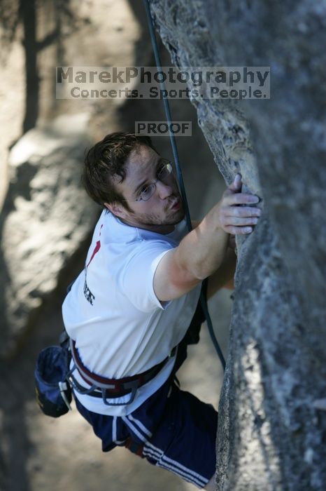 Me top roping Lick the Window (5.10c), shot by Javier Morales from the top of Ack! (5.11b, but using the crack for the start instead) that I top roped up with my camera on my back.  It was another long day of rock climbing at Seismic Wall on Austin's Barton Creek Greenbelt, Sunday, April 5, 2009.

Filename: SRM_20090405_17202274.jpg
Aperture: f/3.5
Shutter Speed: 1/400
Body: Canon EOS-1D Mark II
Lens: Canon EF 80-200mm f/2.8 L