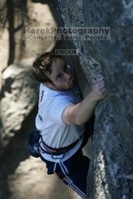 Me top roping Lick the Window (5.10c), shot by Javier Morales from the top of Ack! (5.11b, but using the crack for the start instead) that I top roped up with my camera on my back.  It was another long day of rock climbing at Seismic Wall on Austin's Barton Creek Greenbelt, Sunday, April 5, 2009.

Filename: SRM_20090405_17202382.jpg
Aperture: f/4.0
Shutter Speed: 1/400
Body: Canon EOS-1D Mark II
Lens: Canon EF 80-200mm f/2.8 L