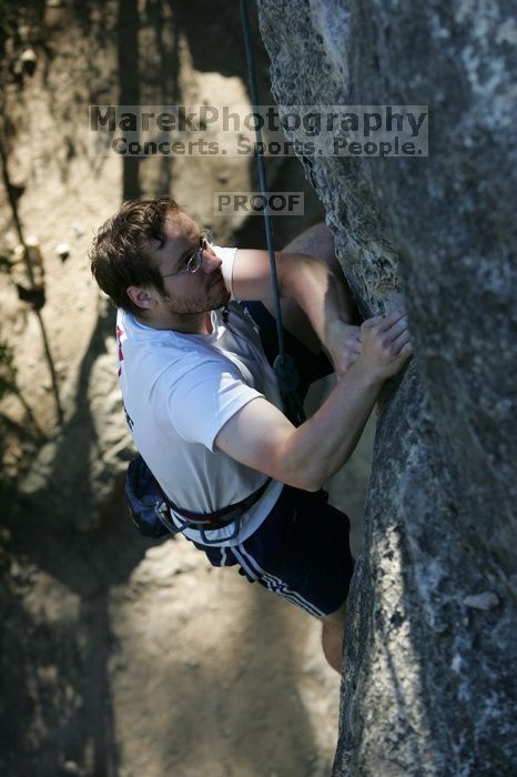 Me top roping Lick the Window (5.10c), shot by Javier Morales from the top of Ack! (5.11b, but using the crack for the start instead) that I top roped up with my camera on my back.  It was another long day of rock climbing at Seismic Wall on Austin's Barton Creek Greenbelt, Sunday, April 5, 2009.

Filename: SRM_20090405_17202994.jpg
Aperture: f/4.0
Shutter Speed: 1/400
Body: Canon EOS-1D Mark II
Lens: Canon EF 80-200mm f/2.8 L