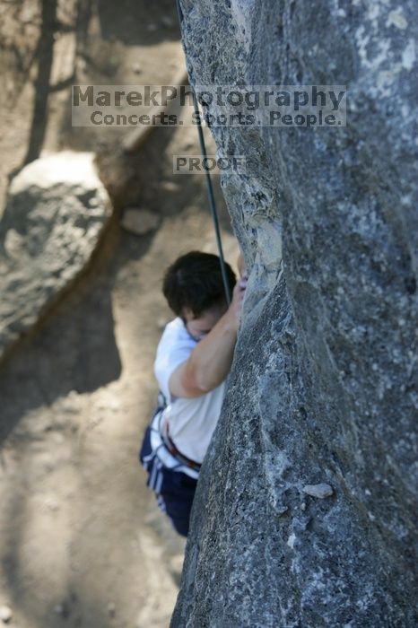 Me top roping Lick the Window (5.10c), shot by Javier Morales from the top of Ack! (5.11b, but using the crack for the start instead) that I top roped up with my camera on my back.  It was another long day of rock climbing at Seismic Wall on Austin's Barton Creek Greenbelt, Sunday, April 5, 2009.

Filename: SRM_20090405_17260940.jpg
Aperture: f/4.5
Shutter Speed: 1/320
Body: Canon EOS-1D Mark II
Lens: Canon EF 80-200mm f/2.8 L