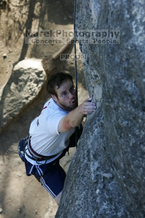 Me top roping Lick the Window (5.10c), shot by Javier Morales from the top of Ack! (5.11b, but using the crack for the start instead) that I top roped up with my camera on my back.  It was another long day of rock climbing at Seismic Wall on Austin's Barton Creek Greenbelt, Sunday, April 5, 2009.

Filename: SRM_20090405_17263166.jpg
Aperture: f/4.5
Shutter Speed: 1/320
Body: Canon EOS-1D Mark II
Lens: Canon EF 80-200mm f/2.8 L