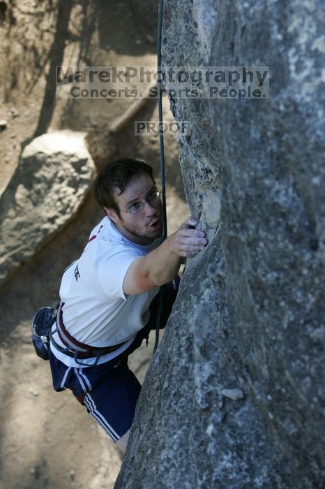 Me top roping Lick the Window (5.10c), shot by Javier Morales from the top of Ack! (5.11b, but using the crack for the start instead) that I top roped up with my camera on my back.  It was another long day of rock climbing at Seismic Wall on Austin's Barton Creek Greenbelt, Sunday, April 5, 2009.

Filename: SRM_20090405_17263167.jpg
Aperture: f/4.5
Shutter Speed: 1/320
Body: Canon EOS-1D Mark II
Lens: Canon EF 80-200mm f/2.8 L