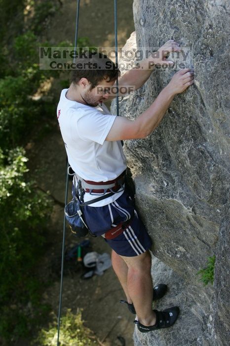 Me top roping Lick the Window (5.10c), shot by Javier Morales from the top of Ack! (5.11b, but using the crack for the start instead) that I top roped up with my camera on my back.  It was another long day of rock climbing at Seismic Wall on Austin's Barton Creek Greenbelt, Sunday, April 5, 2009.

Filename: SRM_20090405_17285745.jpg
Aperture: f/4.5
Shutter Speed: 1/320
Body: Canon EOS-1D Mark II
Lens: Canon EF 80-200mm f/2.8 L