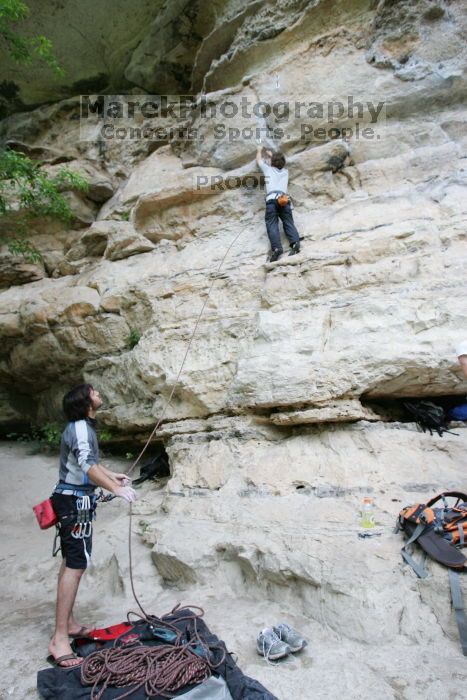 Andrew Dreher lead climbing Magster (5.10a) with Javier Morales belaying.  It was another long day of rock climbing at Seismic Wall on Austin's Barton Creek Greenbelt, Saturday, April 11, 2009.

Filename: SRM_20090411_15294679.JPG
Aperture: f/4.5
Shutter Speed: 1/250
Body: Canon EOS-1D Mark II
Lens: Canon EF 16-35mm f/2.8 L