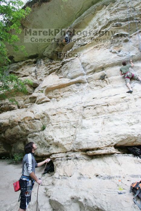 Andrew Dreher lead climbing Magster (5.10a) with Javier Morales belaying.  It was another long day of rock climbing at Seismic Wall on Austin's Barton Creek Greenbelt, Saturday, April 11, 2009.

Filename: SRM_20090411_15332291.JPG
Aperture: f/3.5
Shutter Speed: 1/250
Body: Canon EOS-1D Mark II
Lens: Canon EF 16-35mm f/2.8 L