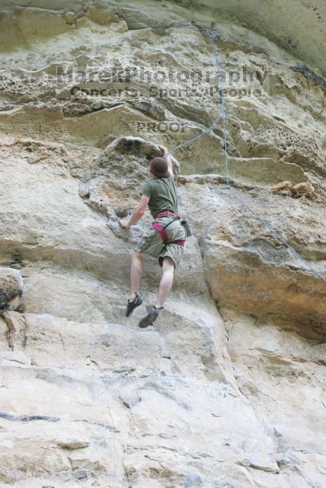 Adam Libson working the dead point on Diving for Rocks (5.10d).  It was another long day of rock climbing at Seismic Wall on Austin's Barton Creek Greenbelt, Saturday, April 11, 2009.

Filename: SRM_20090411_15345893.JPG
Aperture: f/7.1
Shutter Speed: 1/100
Body: Canon EOS-1D Mark II
Lens: Canon EF 16-35mm f/2.8 L