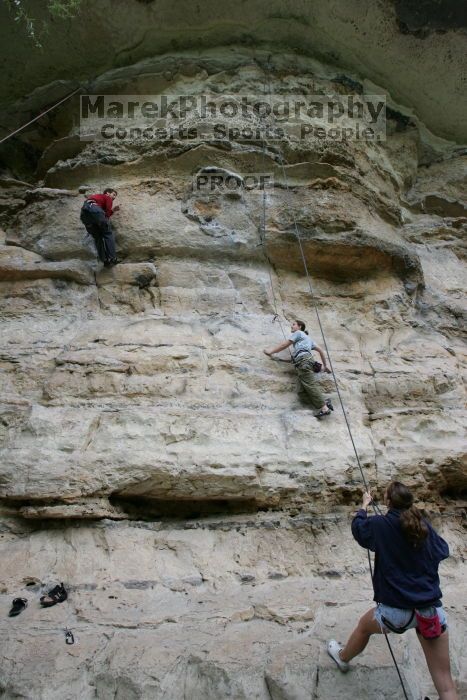 Hannah Norton top rope climbing Diving for Rocks (5.10d), photographed from  the third bolt of Magster (5.10a).  It was another long day of rock climbing at Seismic Wall on Austin's Barton Creek Greenbelt, Saturday, April 11, 2009.

Filename: SRM_20090411_16044839.JPG
Aperture: f/6.3
Shutter Speed: 1/200
Body: Canon EOS-1D Mark II
Lens: Canon EF 16-35mm f/2.8 L