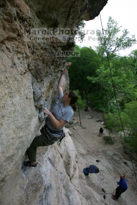 Hannah Norton top rope climbing Diving for Rocks (5.10d), photographed from  the third bolt of Magster (5.10a).  It was another long day of rock climbing at Seismic Wall on Austin's Barton Creek Greenbelt, Saturday, April 11, 2009.

Filename: SRM_20090411_16102847.JPG
Aperture: f/5.0
Shutter Speed: 1/250
Body: Canon EOS-1D Mark II
Lens: Canon EF 16-35mm f/2.8 L