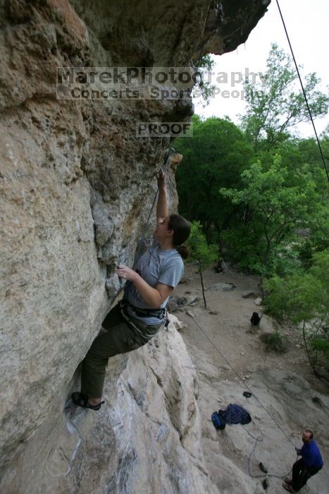 Hannah Norton top rope climbing Diving for Rocks (5.10d), photographed from  the third bolt of Magster (5.10a).  It was another long day of rock climbing at Seismic Wall on Austin's Barton Creek Greenbelt, Saturday, April 11, 2009.

Filename: SRM_20090411_16103150.JPG
Aperture: f/5.0
Shutter Speed: 1/250
Body: Canon EOS-1D Mark II
Lens: Canon EF 16-35mm f/2.8 L